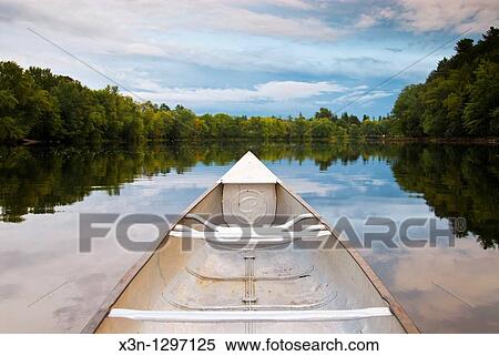 Canoe on the water of Stillwater River, Orono View Large Photo Image Stock Photography - Canoe on the water of Stillwater River, Orono. Fotosearch