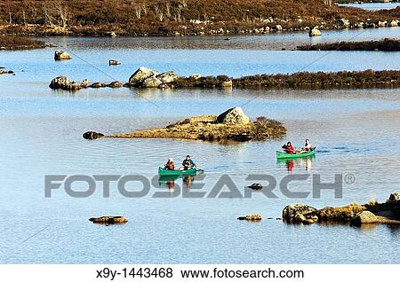 Canoeing kayaking on Loch Ba in Rannoch Moor Grampian Mountains region of Scottish Highlands southeast of Glencoe, Scotland, UK View Large Photo Image Stock Photo - Canoeing kayaking on Loch Ba in Rannoch Moor Grampian Mountains region of Scottish Highlands southeast of Glencoe, Scotland, UK. Fotosearch