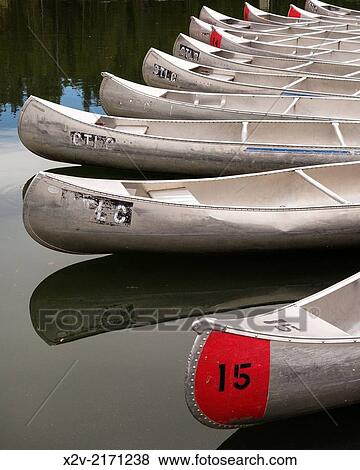 Stock Photo - Canoes at Colter Bay Marina on Jackson Lake in Grand Teton National Park.. Fotosearch