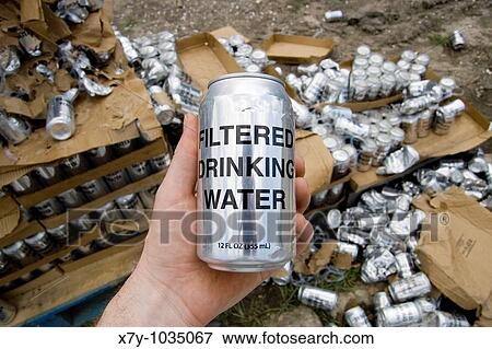 Stock Photo - Cans of water were given out for free in the Lower Ninth Ward section of New Orleans, 9 months after Hurricane Katrina. Fotosearch