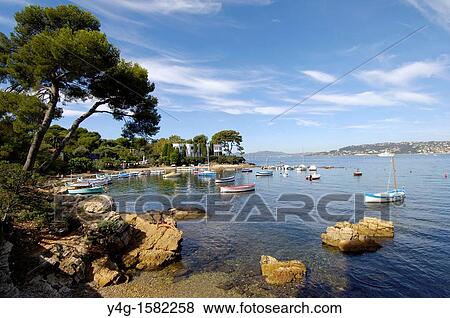 Stock Photo - Cap d? Antibes, small harbour, French Riviera. Fotosearch