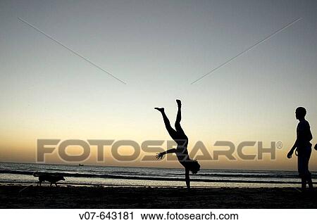 Capoeira players training in the beach, Jericoacora, Brazil. View Large Photo Image Stock Image - Capoeira players training in the beach, Jericoacora, Brazil.. Fotosearch