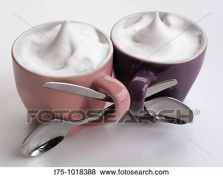 Cappuccinos intertwined View Large Photo Image Stock Photo - Cappuccinos intertwined. Fotosearch