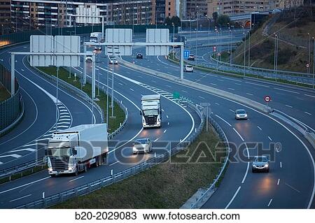 Stock Image - Car and truck traffic on the motorway. Near of San Sebastian. Donostia. Gipuzkoa. Basque Country. Spain.. Fotosearch