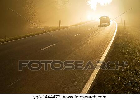 Car driving into bright mist, Bavaria, Germany View Large Photo Image Stock Image - Car driving into bright mist, Bavaria, Germany. Fotosearch