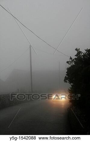 car in thick fog on country lane View Large Photo Image Stock Photo - car in thick fog on country lane. Fotosearch