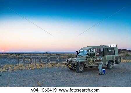 Car stopping on a deserted gravel road in Namibia, Africa View Large Photo Image Stock Photo - Car stopping on a deserted gravel road in Namibia, Africa. Fotosearch