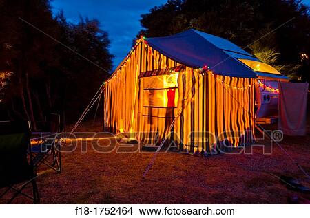 Caravan and tent lit up for Southern hemisphere Christmas festivities - camping at Wanaka, South Island, new Zealand View Large Photo Image Picture - Caravan and tent lit up for Southern hemisphere Christmas festivities - camping at Wanaka, South Island, new Zealand. Fotosearch