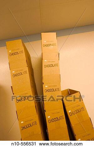 Cardboard boxes, with the word? CHOCOLATE? printed on each, stacked together. View Large Photo Image Stock Image - Cardboard boxes, with the word? CHOCOLATE? printed on each, stacked together.. Fotosearch