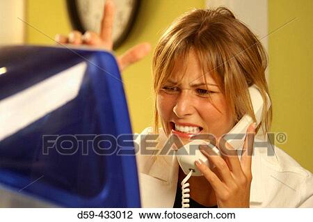 Stock Image - Career woman, worried look on face.. Fotosearch