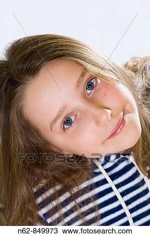 Carefree girl who looks into the camera View Large Photo Image Stock Image - Carefree girl who looks into the camera. Fotosearch