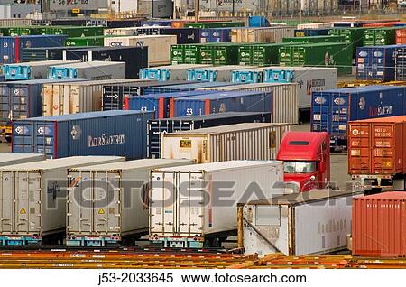 Stock Photography - Cargo containers on trailers, parked at container ship terminal, Port of Tacoma, Washington.. Fotosearch