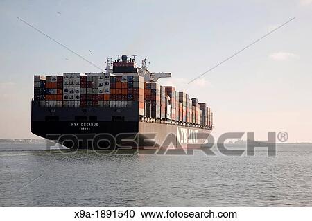Cargo Ship Leaving Southampton Port, England, UK View Large Photo Image Stock Image - Cargo Ship Leaving Southampton Port, England, UK. Fotosearch