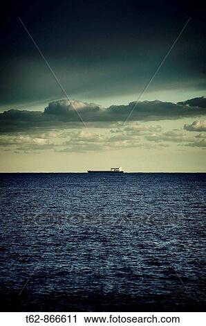 Cargo ship sailing on the horizon Mediterranean Sea View Large Photo Image Stock Image - Cargo ship sailing on the horizon Mediterranean Sea. Fotosearch