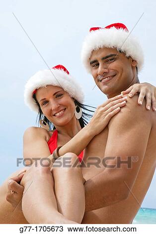 Caribbean Barbados Couple with Santa hats. View Large Photo Image Stock Image - Caribbean Barbados Couple with Santa hats.. Fotosearch