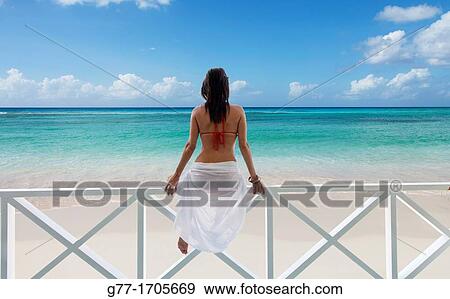 Caribbean Barbados Woman on a deserted beach. View Large Photo Image Stock Photo - Caribbean Barbados Woman on a deserted beach.. Fotosearch