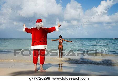 Caribbean Dominican Republic Samana Peninsula Las Terrenas Man with Santa's costume and woman View Large Photo Image Stock Photo - Caribbean Dominican Republic Samana Peninsula Las Terrenas Man with Santa's costume and woman. Fotosearch