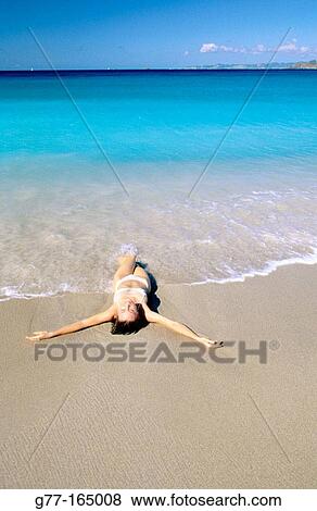 Caribbean, Saint Barthelemy, woman on beach at colombier bay View Large Photo Image Stock Photo - Caribbean, Saint Barthelemy, woman on beach at colombier bay. Fotosearch
