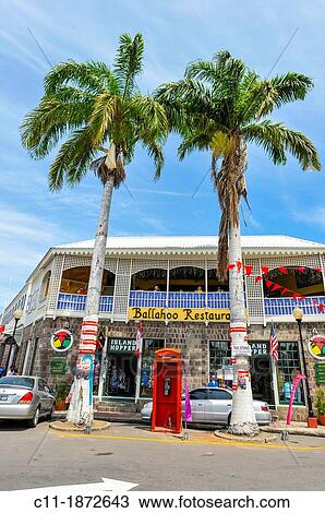 Caribbean, Saint Kitts and Nevis, Basseterre, Palm trees and colonial style building View Large Photo Image Stock Image - Caribbean, Saint Kitts and Nevis, Basseterre, Palm trees and colonial style building. Fotosearch