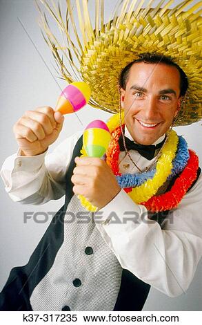 Caribbean style entertainer wearing palm frond hat and leis around his neck View Large Photo Image Stock Photography - Caribbean style entertainer wearing palm frond hat and leis around his neck. Fotosearch