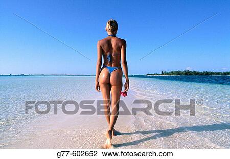 Stock Image - Caribbean. Woman on tropical beach. Cuba, Cayo Largo. Fotosearch