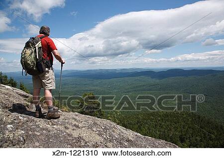 Caribou - Speckled Mountain Wilderness - A hiker takes in the view along Mud Brook Trail in the White Mountain National Forest of Maine Mud Brook Trail travels to the summit of Caribou Mountain View Large Photo Image Stock Image - Caribou - Speckled Mountain Wilderness - A hiker takes in the view along Mud Brook Trail in the White Mountain National Forest of Maine Mud Brook Trail travels to the summit of Caribou Mountain. Fotosearch