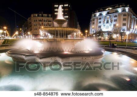 Carlton hotel and fountain in the square Moyua of Bilbao, Biscay, Basque Country, Spain. View Large Photo Image Stock Photograph - Carlton hotel and fountain in the square Moyua of Bilbao, Biscay, Basque Country, Spain.. Fotosearch
