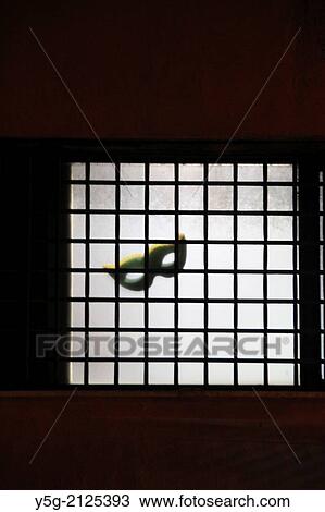 carnival mask on property window at night in rome italy View Large Photo Image Stock Image - carnival mask on property window at night in rome italy. Fotosearch