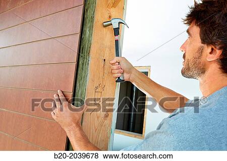 Carpenter with hammer with carbon fiber handle. Construction of residential building. Donostia. San Sebastian. Gipuzkoa. Basque Country. Spain. View Large Photo Image Stock Photo - Carpenter with hammer with carbon fiber handle. Construction of residential building. Donostia. San Sebastian. Gipuzkoa. Basque Country. Spain.. Fotosearch