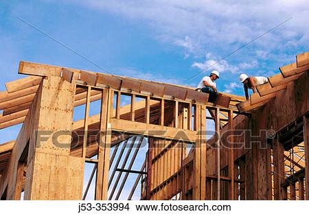 Carpenters framing a roof. Grass Valley, California. USA. View Large Photo Image Picture - Carpenters framing a roof. Grass Valley, California. USA.. Fotosearch