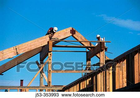Carpenters framing a roof. Grass Valley, California. USA. View Large Photo Image Stock Image - Carpenters framing a roof. Grass Valley, California. USA.. Fotosearch