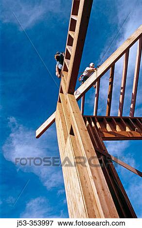 Carpenters framing a roof. Grass Valley, California. USA. View Large Photo Image Stock Photo - Carpenters framing a roof. Grass Valley, California. USA.. Fotosearch