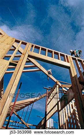 Carpenters framing a roof. Grass Valley, California. USA. View Large Photo Image Stock Photo - Carpenters framing a roof. Grass Valley, California. USA.. Fotosearch