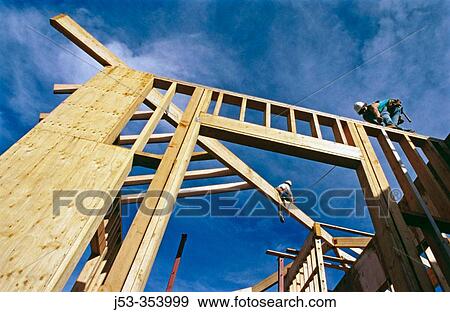 Carpenters framing a roof. Grass Valley, California. USA. View Large Photo Image Stock Photo - Carpenters framing a roof. Grass Valley, California. USA.. Fotosearch