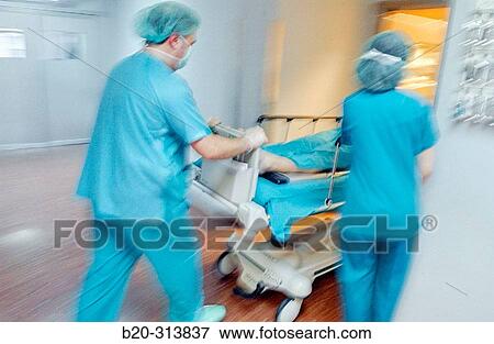 Carrying patient from operation room to resuscitation room, surgery area of hospital View Large Photo Image Stock Photo - Carrying patient from operation room to resuscitation room, surgery area of hospital. Fotosearch