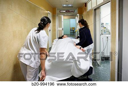 Carrying patient on couch, emergency. Hospital Policlinica Gipuzkoa, San Sebastian, Donostia, Euskadi, Spain View Large Photo Image Stock Photograph - Carrying patient on couch, emergency. Hospital Policlinica Gipuzkoa, San Sebastian, Donostia, Euskadi, Spain. Fotosearch