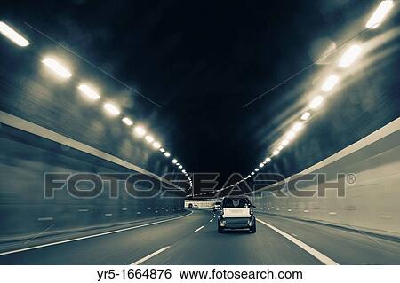 Cars approaching tunnel exit View Large Photo Image Stock Photograph - Cars approaching tunnel exit. Fotosearch