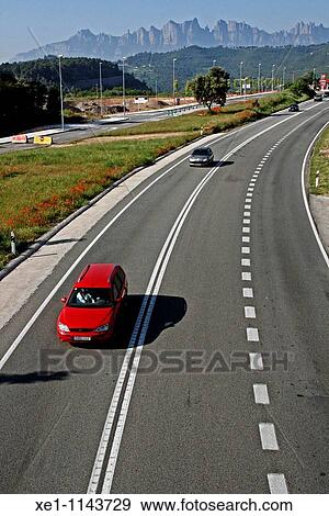 Stock Photo - cars circulation, Montserrat mountain, Bages, Catalonia, Spain.. Fotosearch
