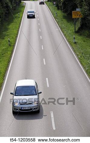 Cars on a road View Large Photo Image Stock Photo - Cars on a road. Fotosearch