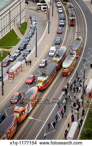 Cars, trams and people on Solidarity Avenue Aleja Solidarnosci, one of the main thoroughfares in Warsaw Poland View Large Photo Image Picture - Cars, trams and people on Solidarity Avenue Aleja Solidarnosci, one of the main thoroughfares in Warsaw Poland. Fotosearch