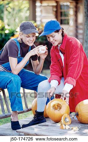 Carving pumpkins View Large Photo Image Stock Photograph - Carving pumpkins. Fotosearch