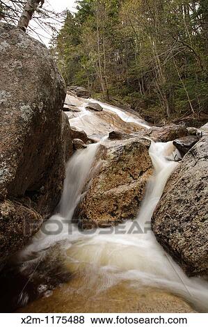 Stock Photo - Cascade along the South Branch of Hancock Brook in Lincoln, New Hampshire USA This river is located near the Kancamagus Highway route 112 which is one of New England's scenic byways. Fotosearch