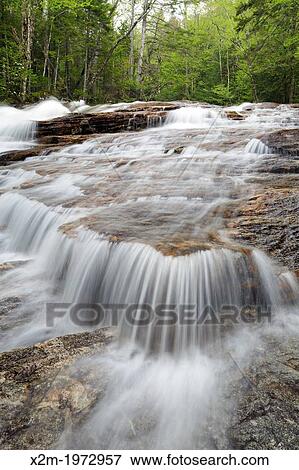 Cascade Brook during the spring months. This brook is located along the Basin-Cascades Trail in the Lincoln, New Hampshire USA. View Large Photo Image Stock Photo - Cascade Brook during the spring months. This brook is located along the Basin-Cascades Trail in the Lincoln, New Hampshire USA.. Fotosearch