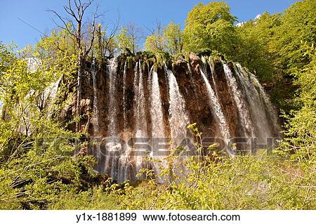 Cascades of water running over the travetine deposits between the lakes of Plitvice. Plitvice Plitvi-ka Lakes National Park, Croatia. A UNESCO World Heritage Site View Large Photo Image Stock Photo - Cascades of water running over the travetine deposits between the lakes of Plitvice. Plitvice Plitvi-ka Lakes National Park, Croatia. A UNESCO World Heritage Site. Fotosearch