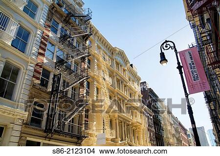 Cast Iron Landmarked Buildings with Exterior Fire Escapes, Green Street, Soho, Manhattan, New York City. View Large Photo Image Picture - Cast Iron Landmarked Buildings with Exterior Fire Escapes, Green Street, Soho, Manhattan, New York City.. Fotosearch