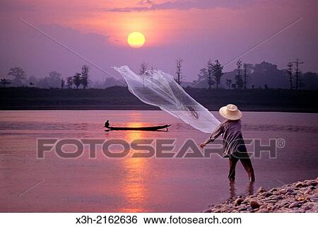 cast net fishing on Mekong River at sunset in northeastern Thailand, Southeast Asia. View Large Photo Image Stock Photograph - cast net fishing on Mekong River at sunset in northeastern Thailand, Southeast Asia.. Fotosearch