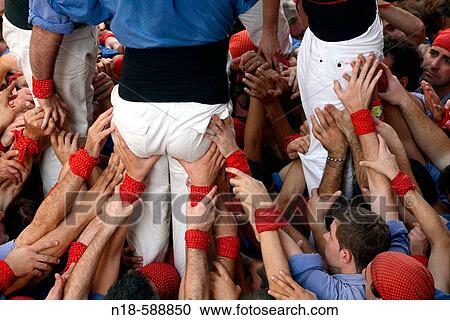 ? Castellers? building human towers, a Catalan tradition. Sant Narc? s. Girona, Catalonia, Spain View Large Photo Image Stock Image - ? Castellers? building human towers, a Catalan tradition. Sant Narc? s. Girona, Catalonia, Spain. Fotosearch