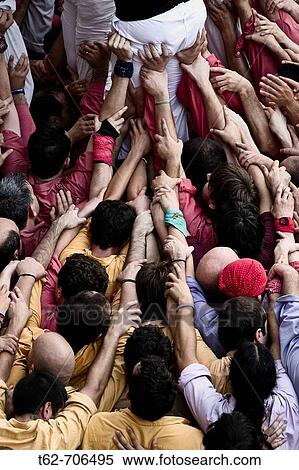 Castellers, building human towers, a catalan tradition. Barcelona, Catalunya, Spain. View Large Photo Image Stock Photography - Castellers, building human towers, a catalan tradition. Barcelona, Catalunya, Spain.. Fotosearch