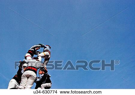 Picture - Castellers" (catalan tradition), human tower during Santa Eul? lia festivities, 2007. Barcelona. Spain. ". Fotosearch
