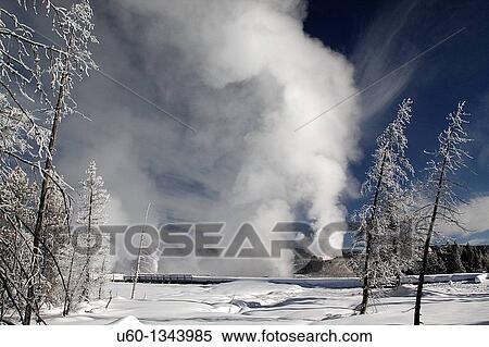 Castle Geyser erupts under a bright winter sky at Yellowstone National Park View Large Photo Image Stock Photography - Castle Geyser erupts under a bright winter sky at Yellowstone National Park. Fotosearch